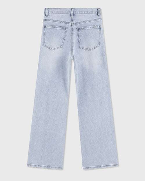 bő szárú farmer, asszimetrikus derekú hátulról